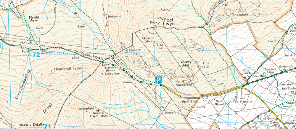 A close up of black symbols - cairns, powerlines, paths - on an OS map