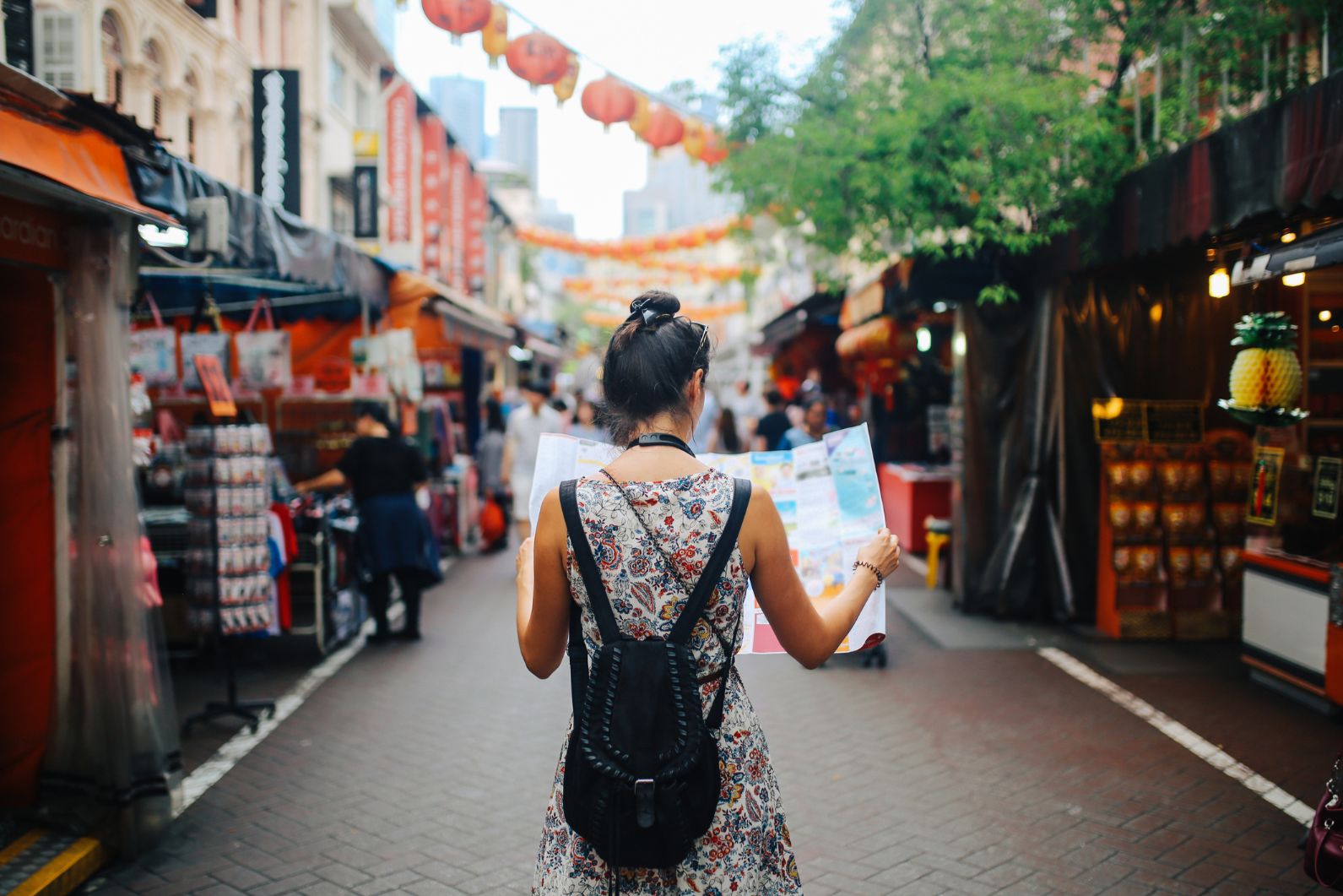 A woman traveller looking at a map.