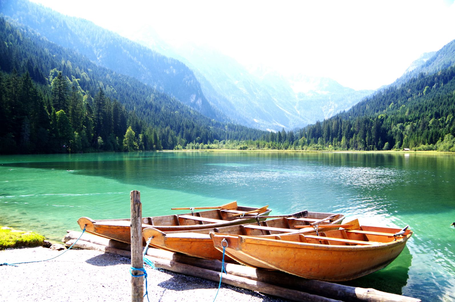 Wooden boats and a turquoise lake