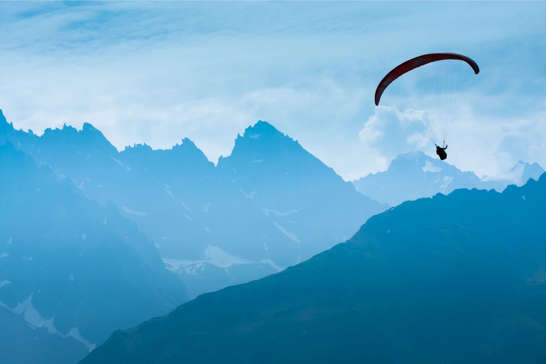 A paraglider over the French Alps.