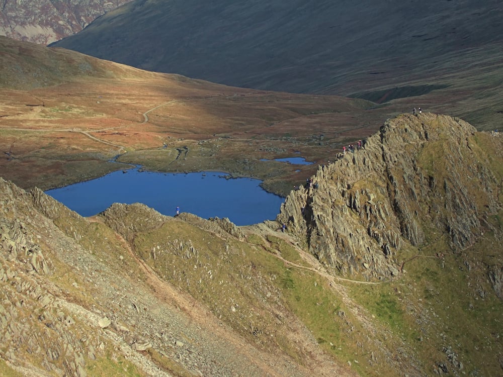 Scramblers on Striding Edge in the Lake District.