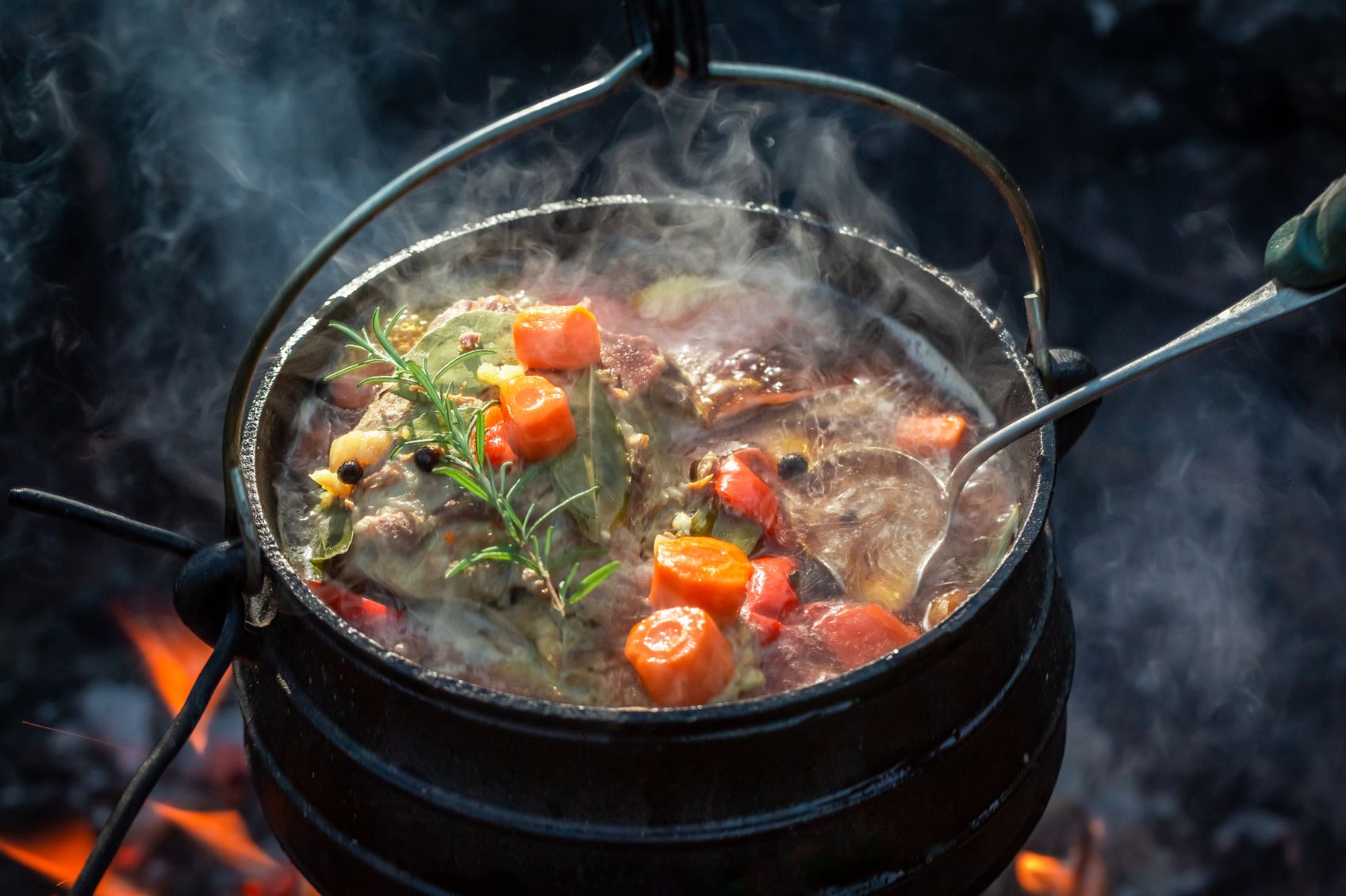  A steaming pot of campfire stew on campfire