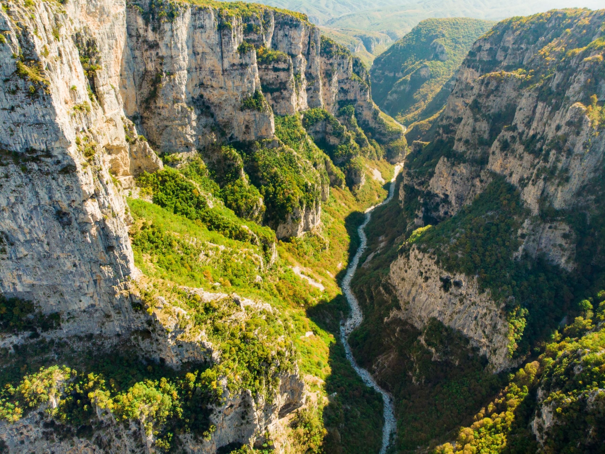 Hiking in Greece can mean anything from the Vikos Gorge, above, to a coastal dream
