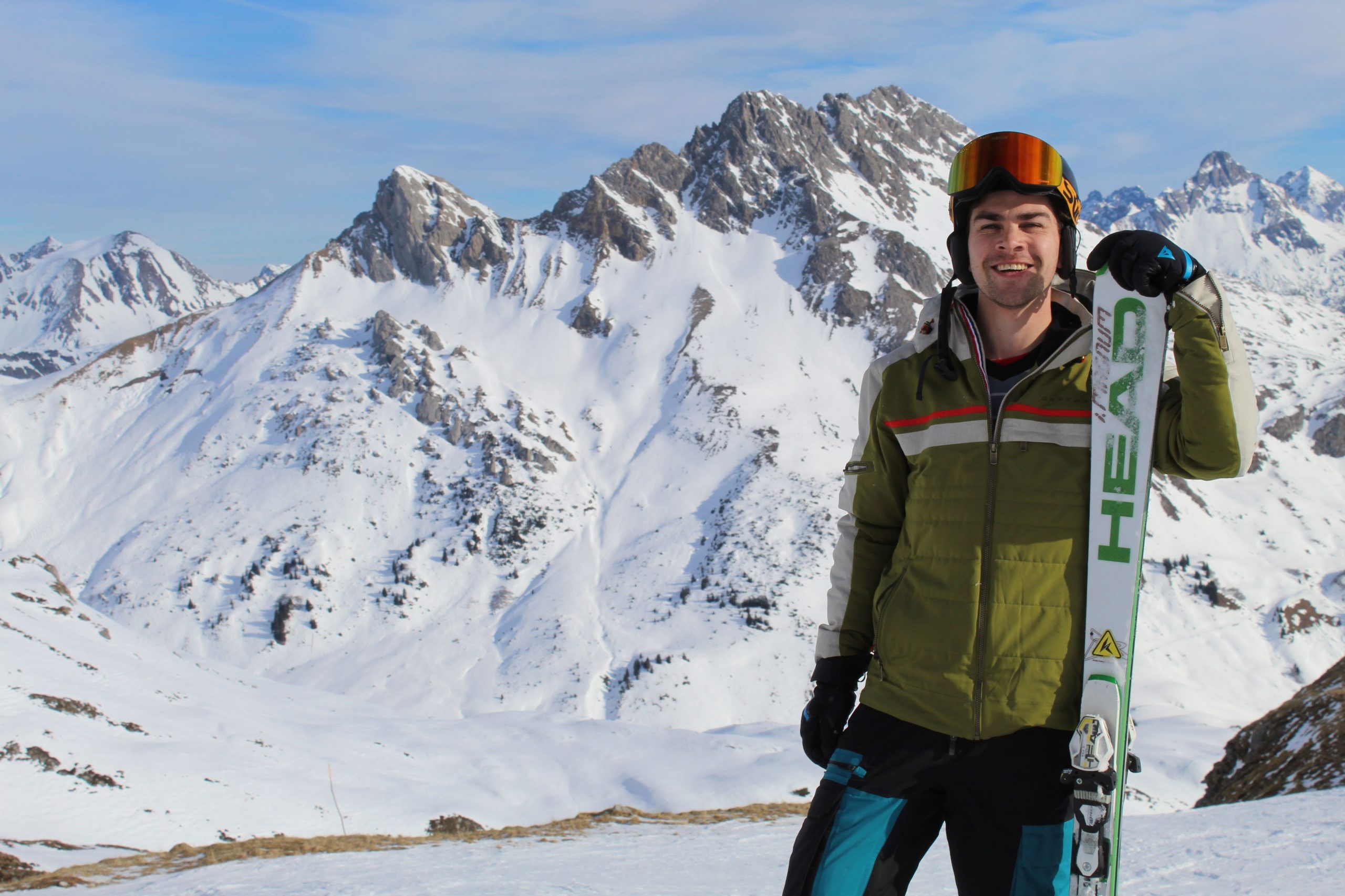 A skier posing at the top of Lech-Zurs ski resort 
