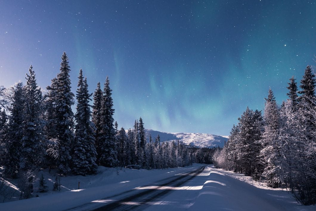 Northern lights above Pallas Mountains at night in Pallas-Yllästunturi National Park, Finland