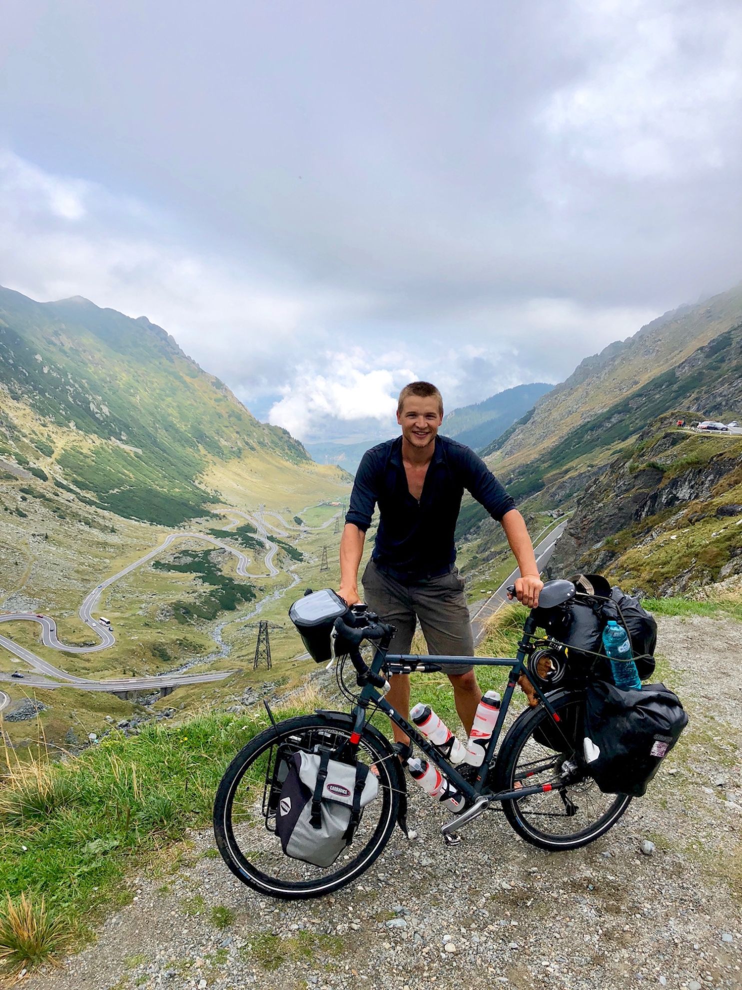 Author and adventurer Geordie Stewart posing with his bike on the Transfagarasan Highway