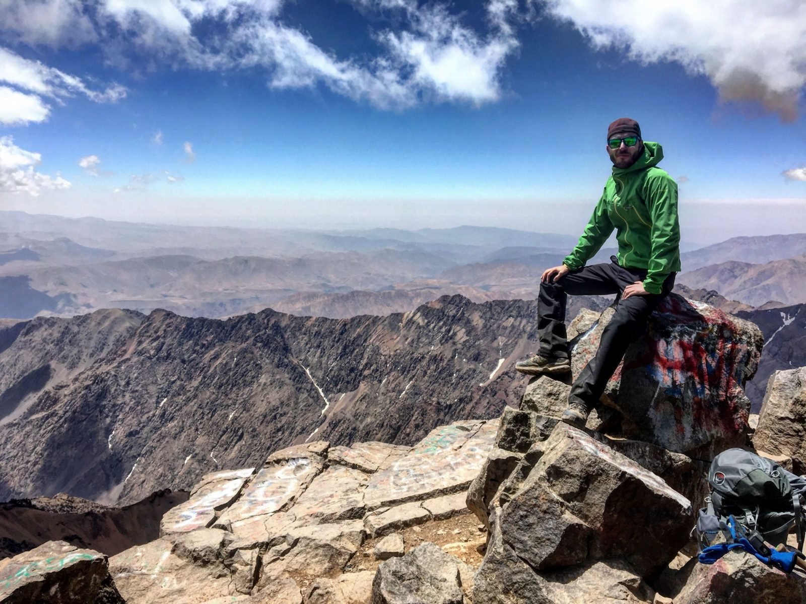 A hiker at the top of Mount Toubkal