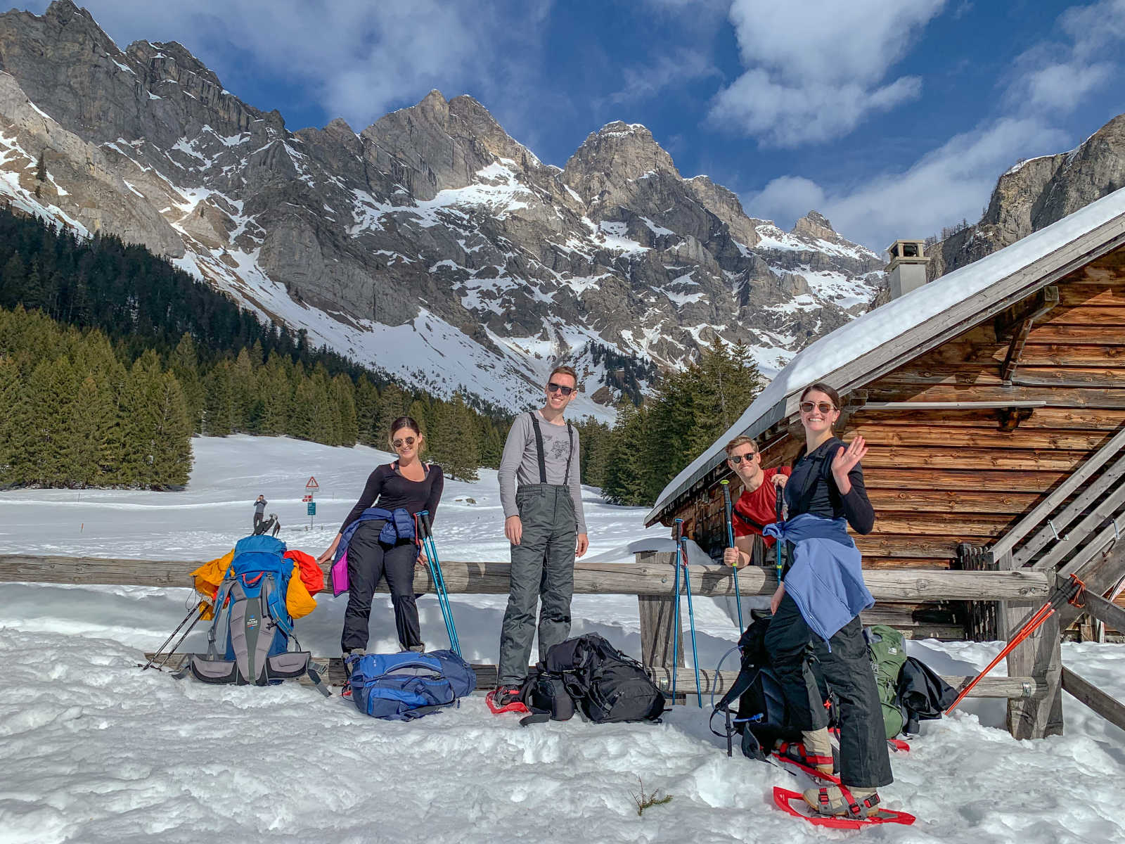A group poses, wearing snowshoes, in the French Alps.