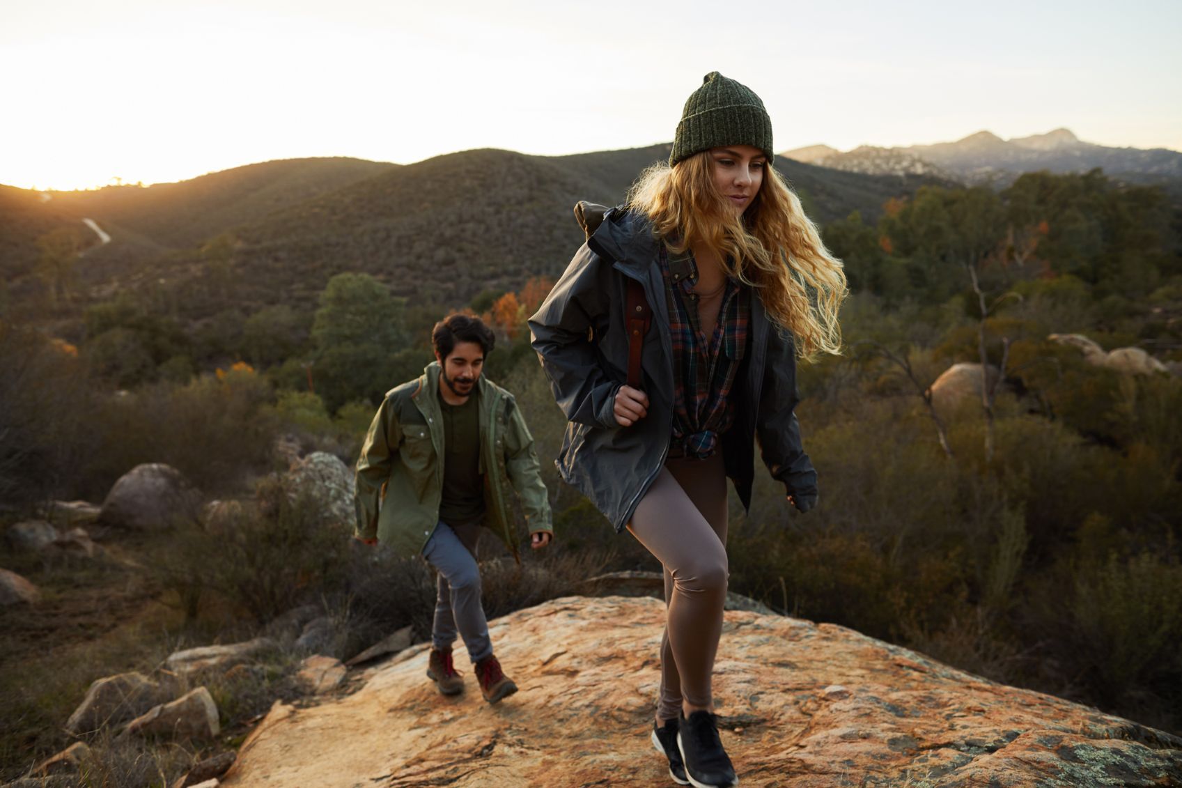 A young couple hiking in the mountains