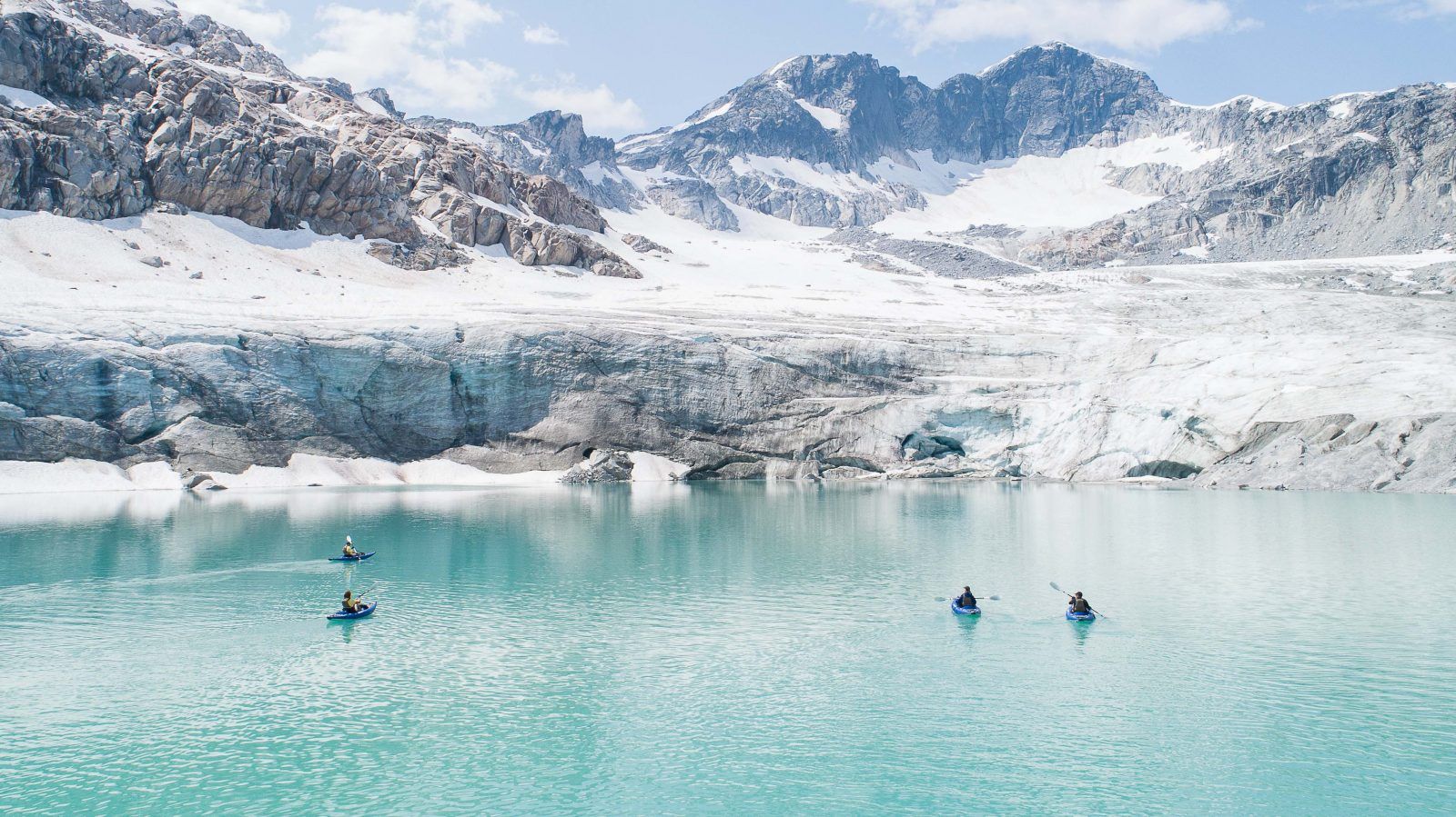 An 100km Kayaking Expedition in Greenland, with paddlers looking on to the grand environment.