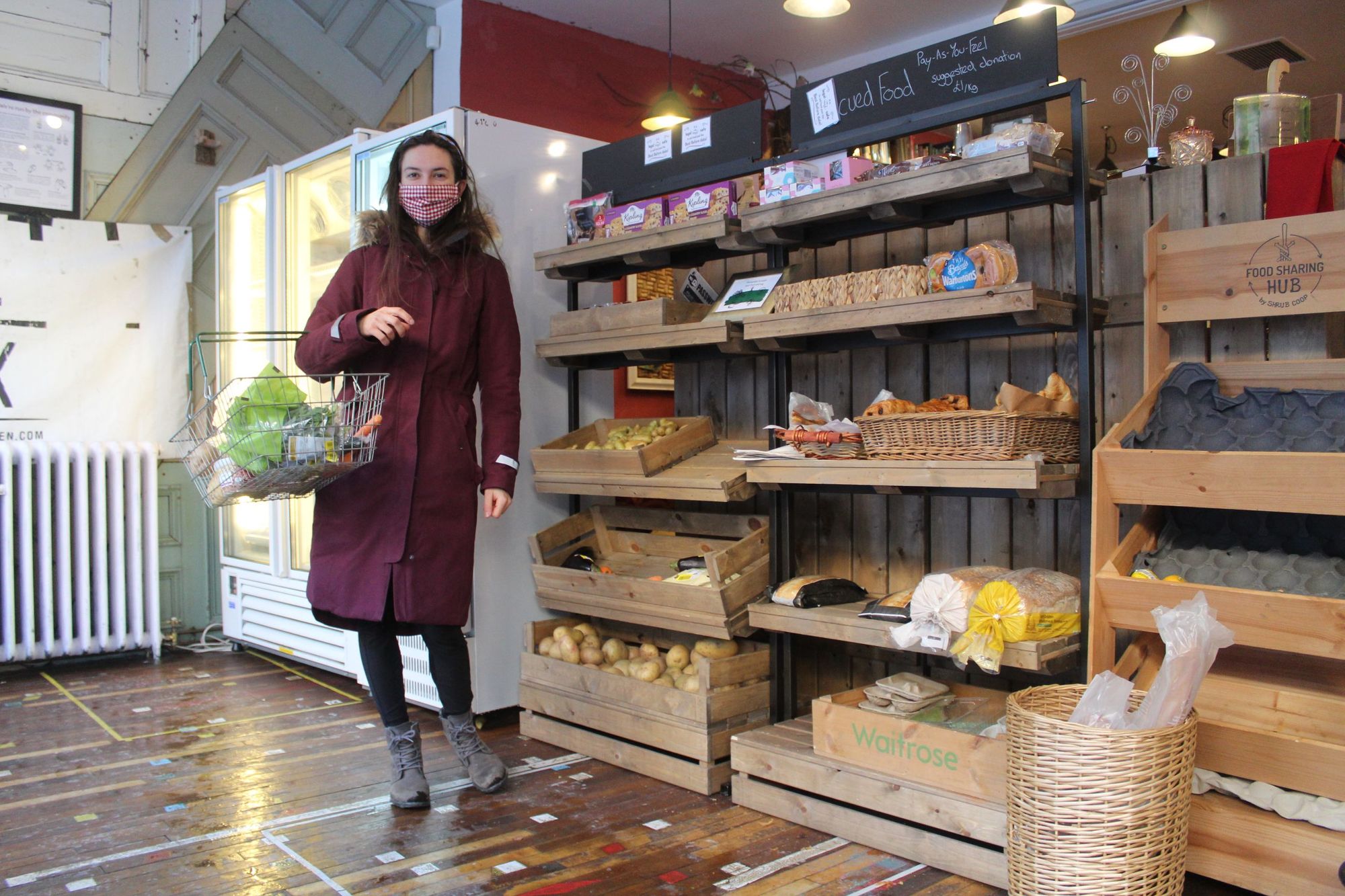 A shopper grabbing some food at the SHRUB's Zero Waste Hub. Photo: Stuart Kenny