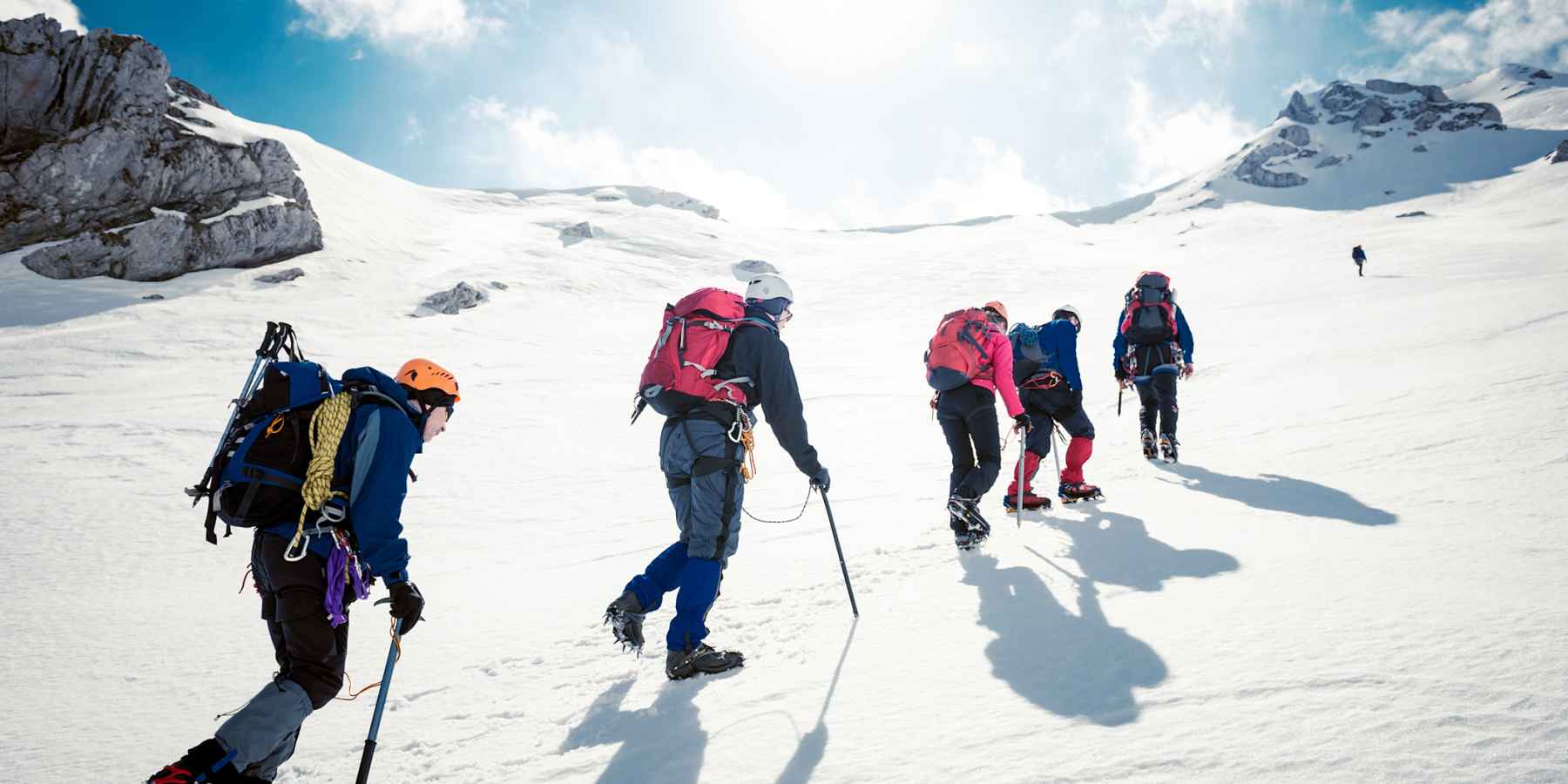 A group of mountaineers summiting Yala Peak.