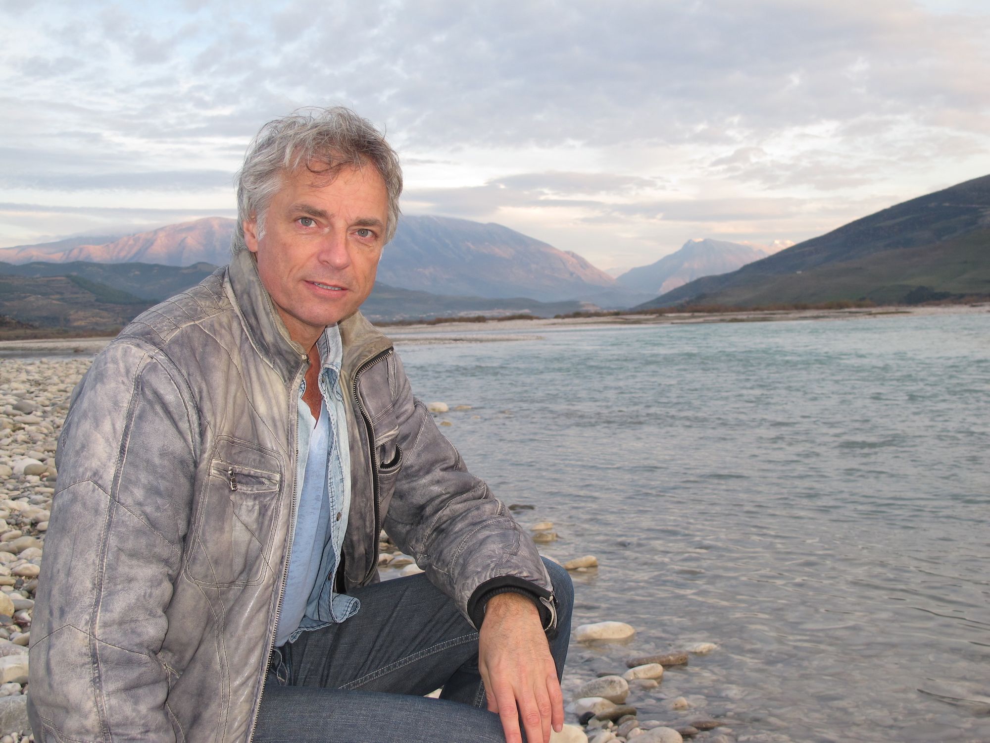 A photo of Ulrich Eichelmann, CEO of River Watch, by a river.