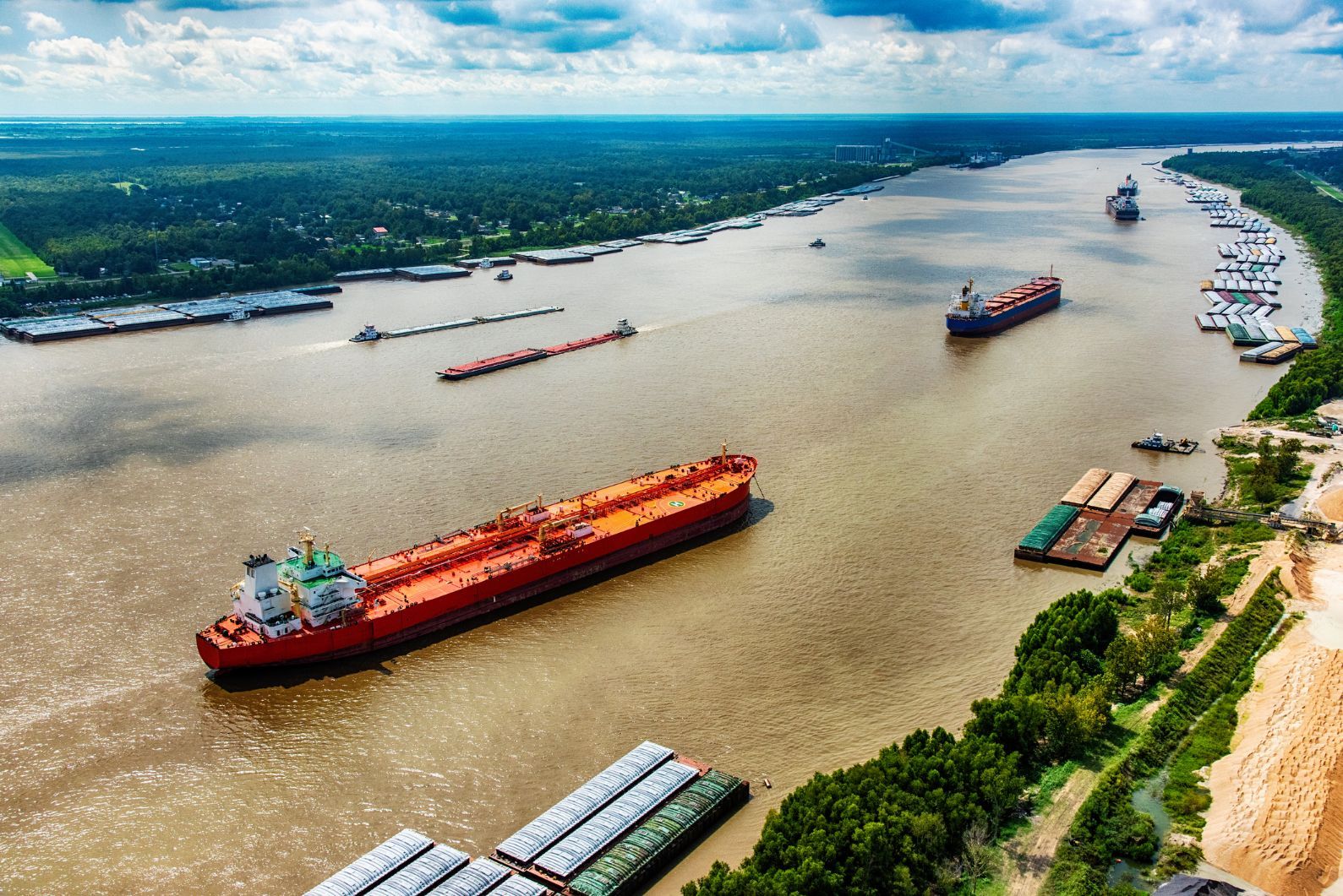 A stock photo, not from Ian's trip, but showing the sort of terrain, barges, tankers and containers that line the Mississippi. This particular stretch is just north of New Orleans. Photo: Getty