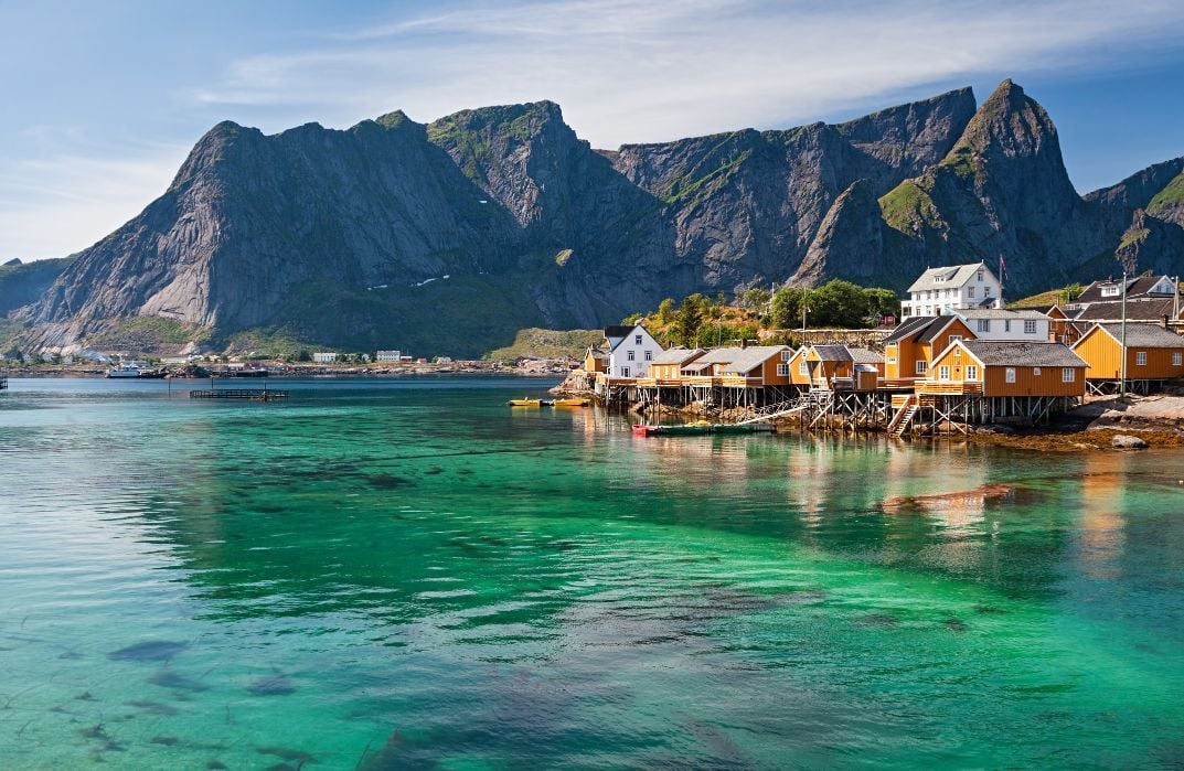 Rorbuer huts near Reine in the Lofoten islands. Exploring via kayak is a great way to see the coast