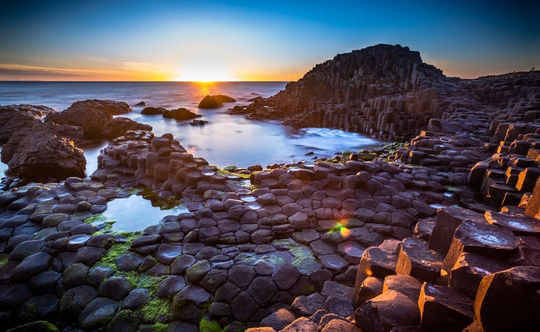 Sunset over the famous hexagonal stones of the Giant's Causeway in Country Antrim, Northern Ireland
