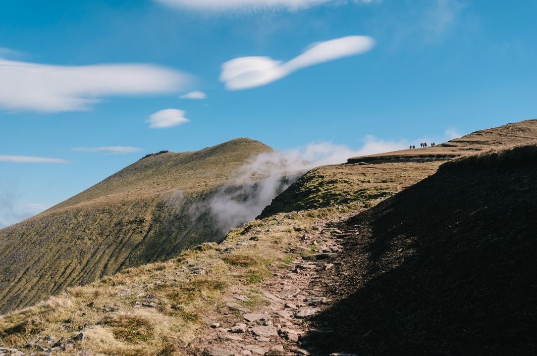 Hikers in the distance on the approach to Gaitymore Mountain, Ireland.