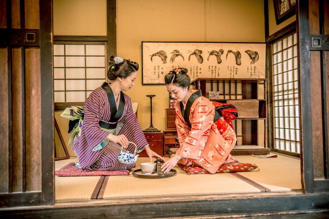 A Japanese tea ceremony in a traditional tea room.