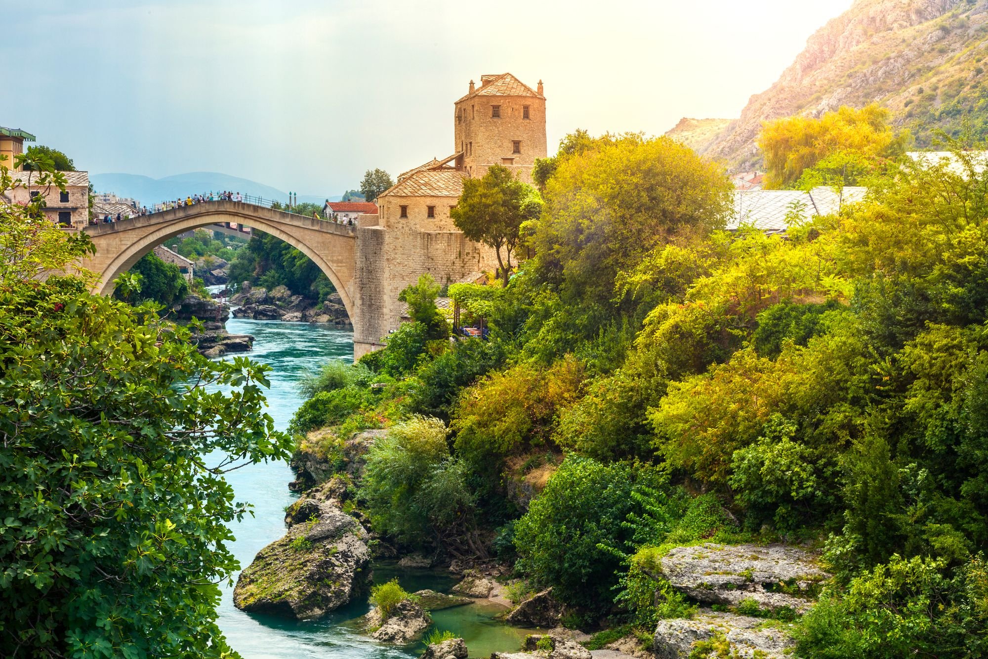 The stunning Mostar Bridge, arching over the turquoise river.