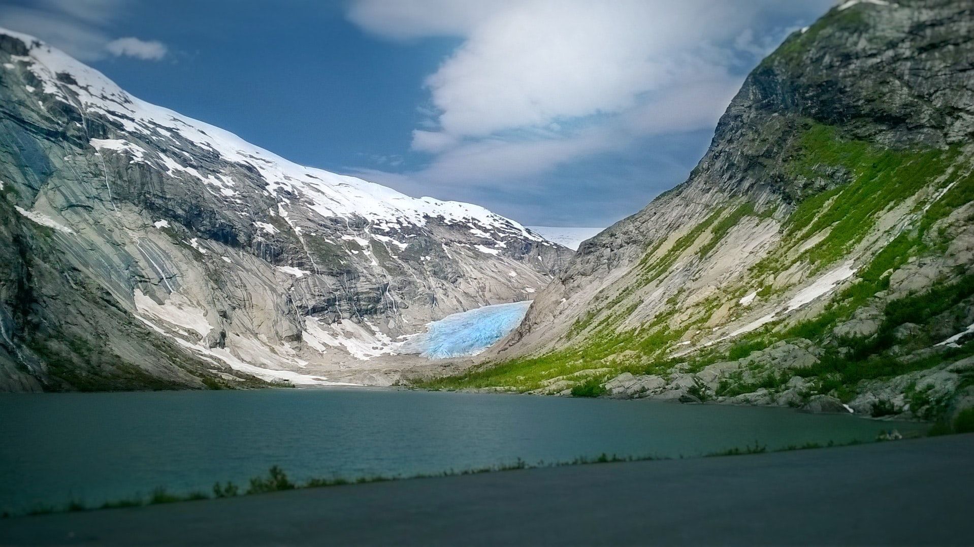 A lake meets a glacier on a stunning Norwegian fjord.