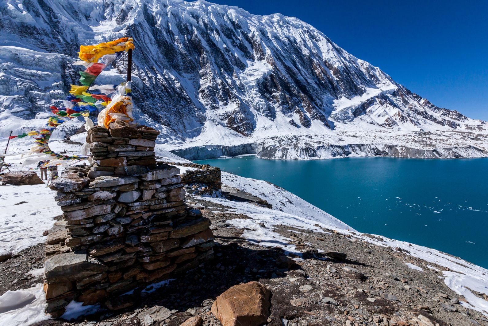 A stone stupa with prayer flags near Tilicho lake in the Annapurna Conservation Area.
