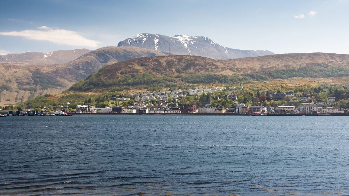 A view of Loch Linnhe, with Fort William on the shore and Ben Nevis behind.
