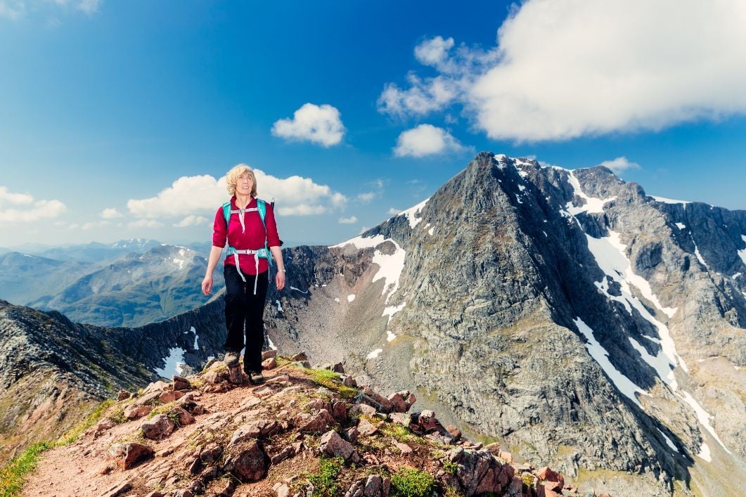 A woman hiker on the CMD route up Ben Nevis, in Scotland.