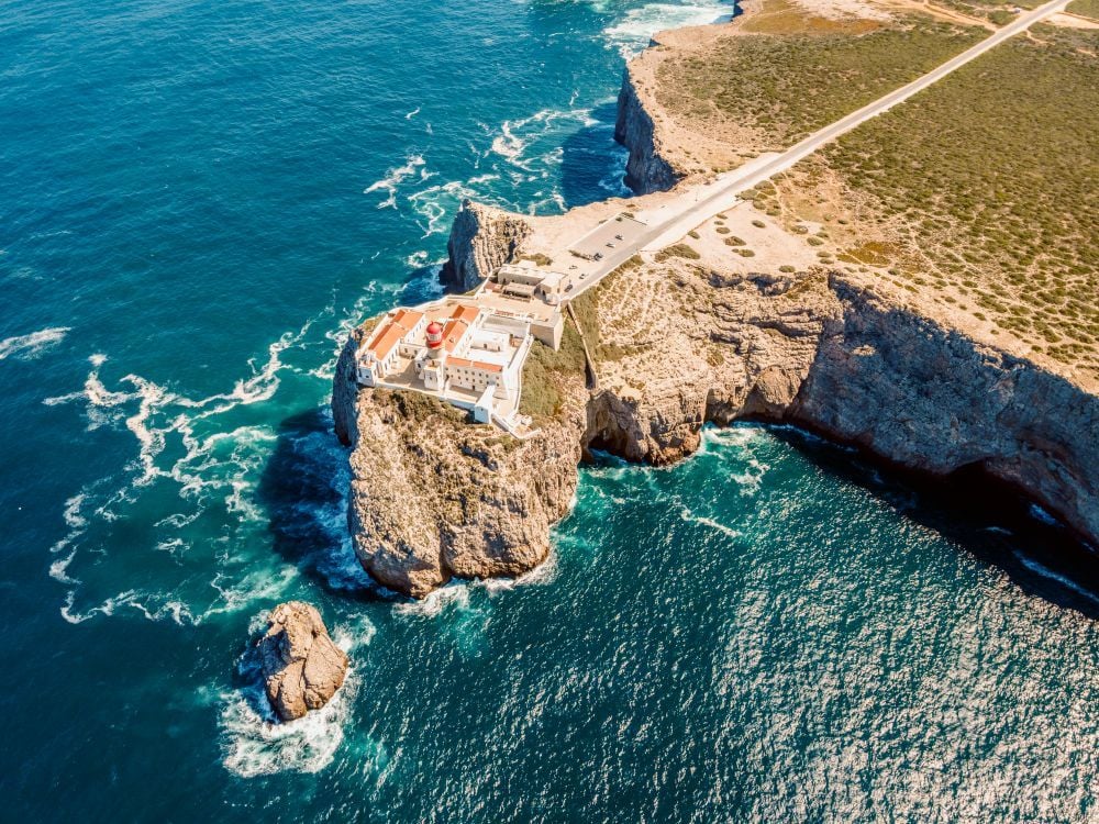 The lighthouse and cliffs at Cape St. Vincent, continental Europe's most south-western point, in Sagres, Portugal, and the end of the European Divide Trail. Photo: Getty