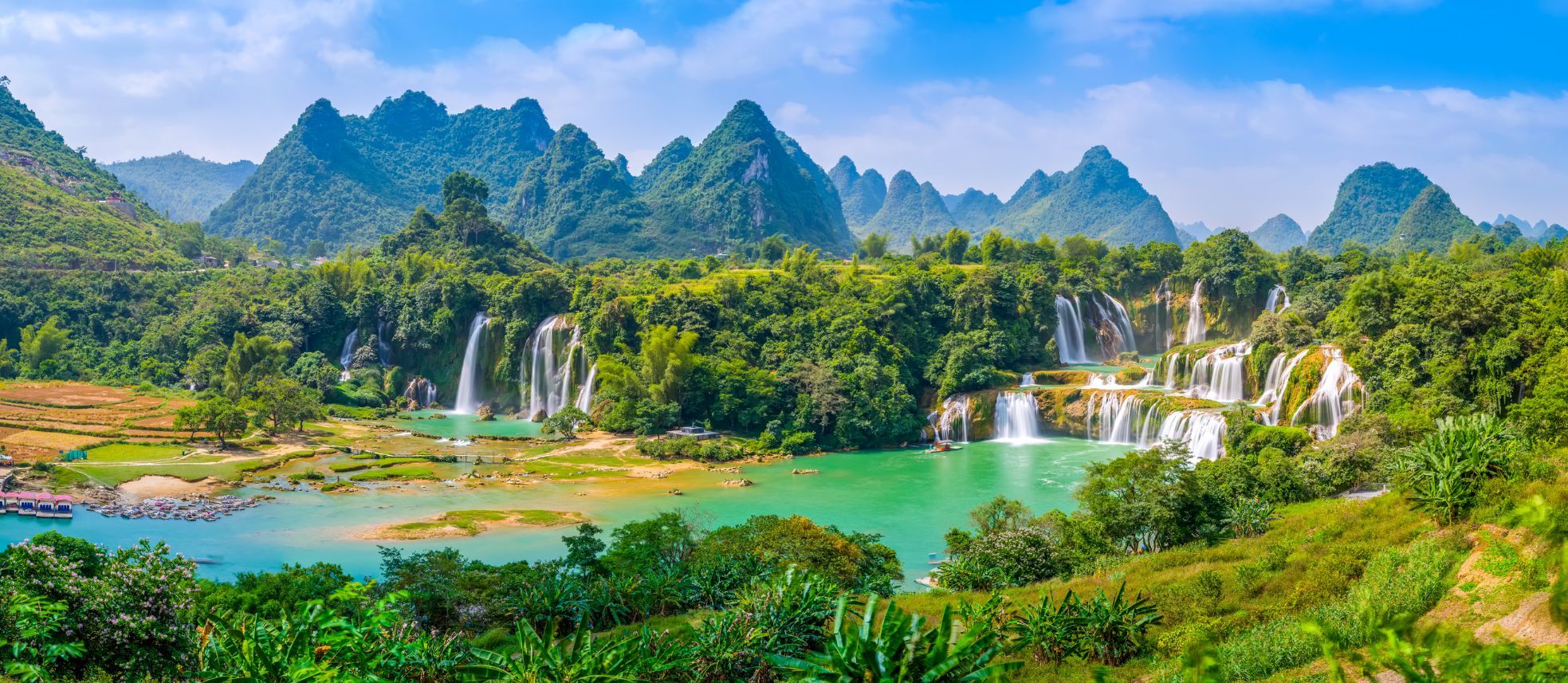 The Detian cross-border waterfall, surrounded by dense jungle. 