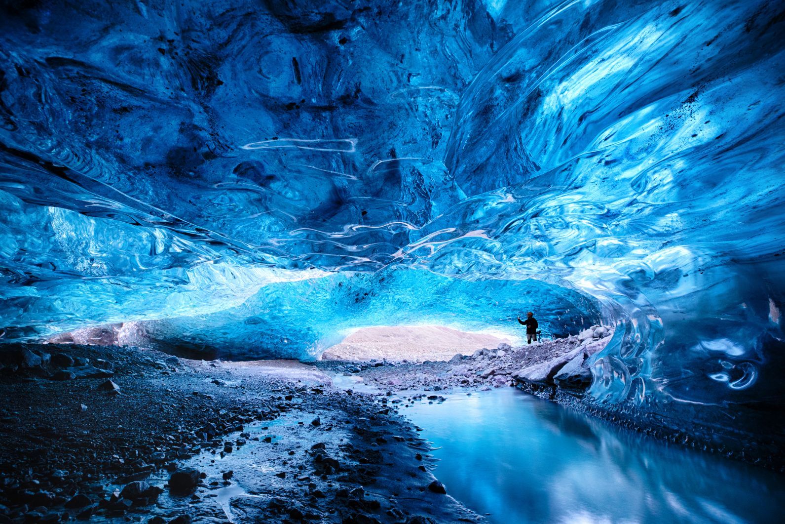 Inside a blue glacial ice cave in the glacier. Breioarmerkurjokull, part of the Vatnajokull glacier in southeast Iceland. Photo: Getty