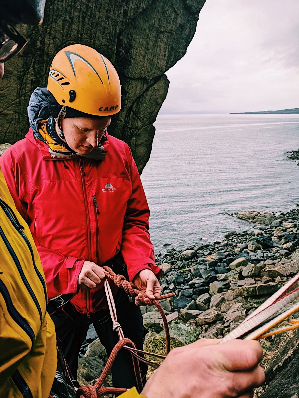 A climber ties a figure of eight knot.