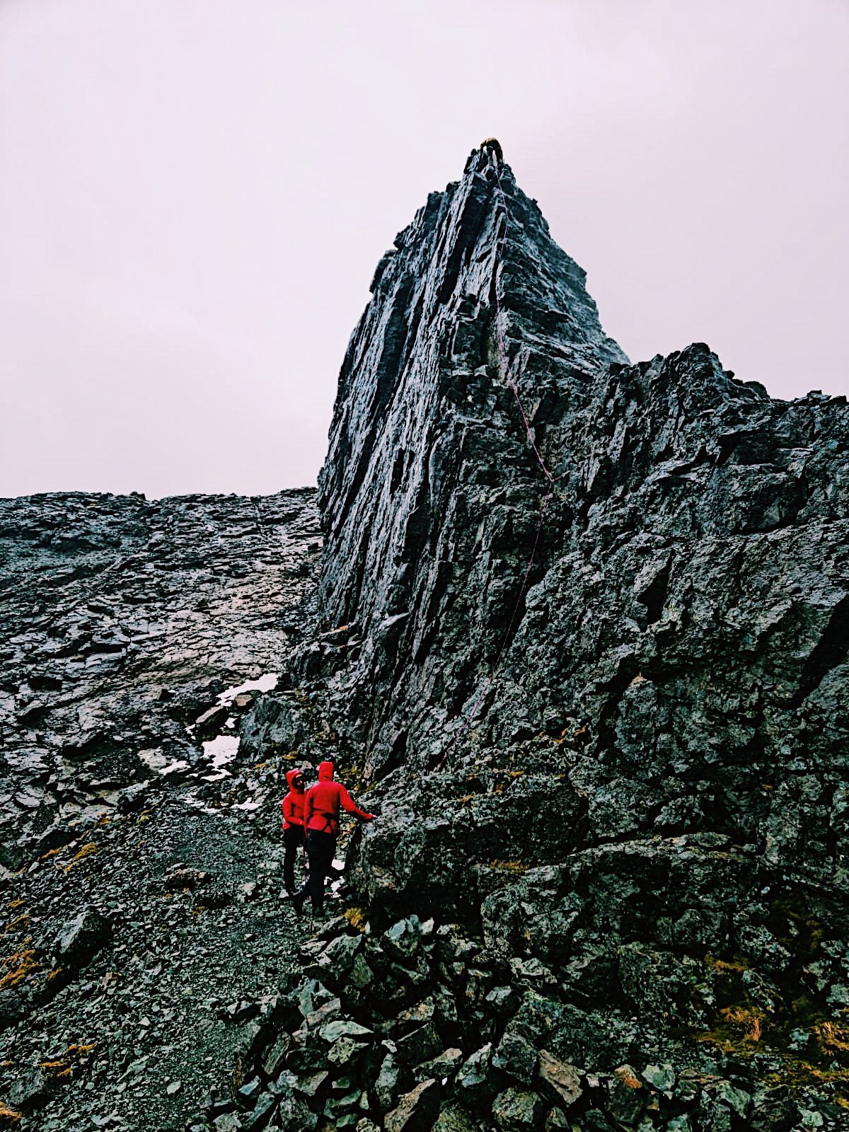 Two climbers getting ready to climb Inaccessible Pinnacle, on the Isle of Skye.