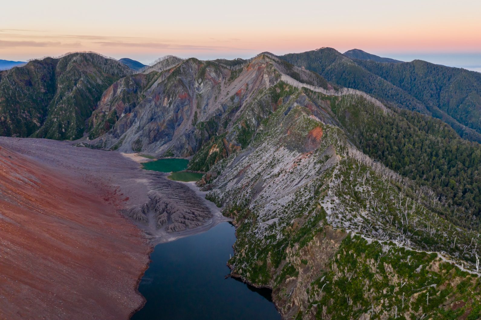 The view at the end of the hike to the crater rim of Chaiten volcano, looking into the caldera in Parque Pumalín