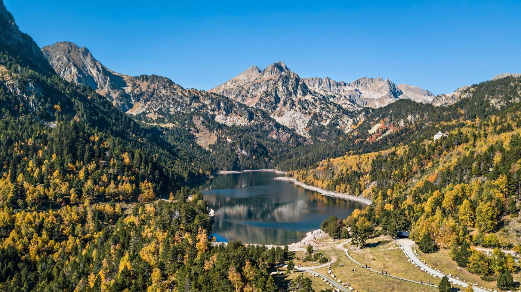 The stunning Sant Maurici lake, in the Pyrenees in Catalonia, Spain during Autumn