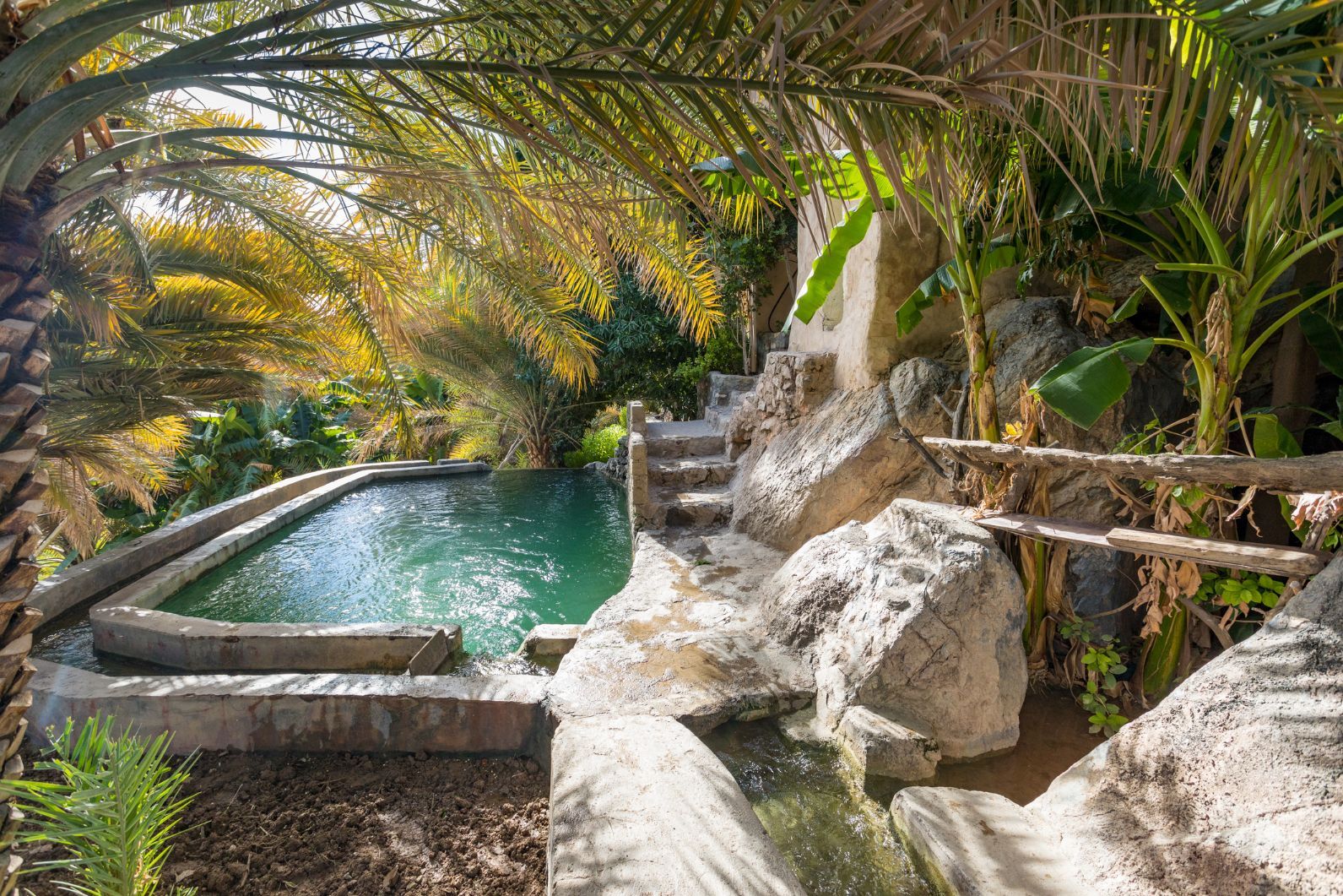 A spring in Misfat Al Abriyeen, a lush oasis in a seemingly arid environment in Oman