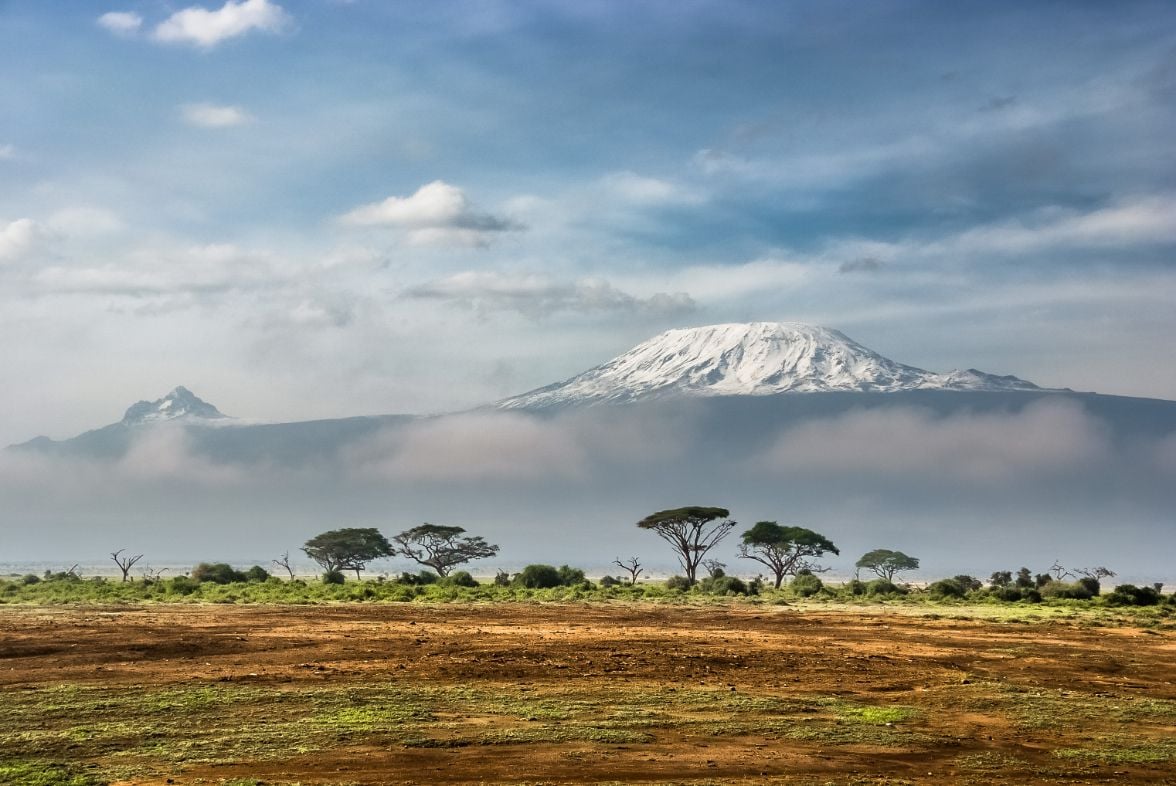 The snow capped summit of Mount Kilimanjaro, with the plains laid out below.
