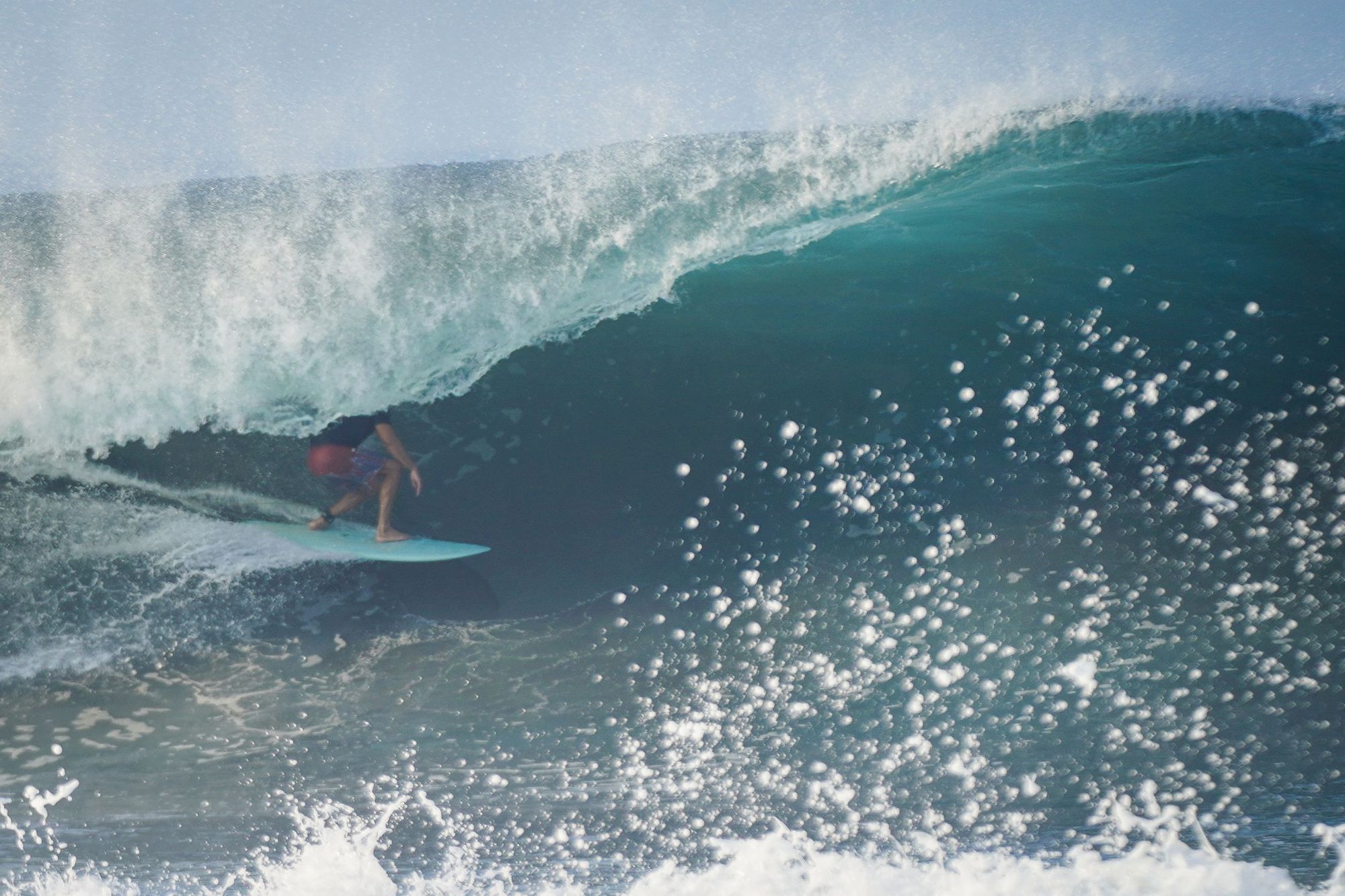 Surfer Damien Castera getting barrelled in a wave