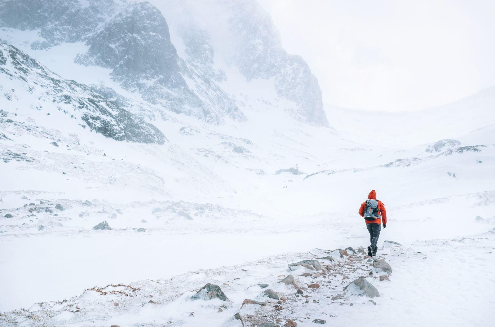 A hiker climbing Ben Nevis in Winter