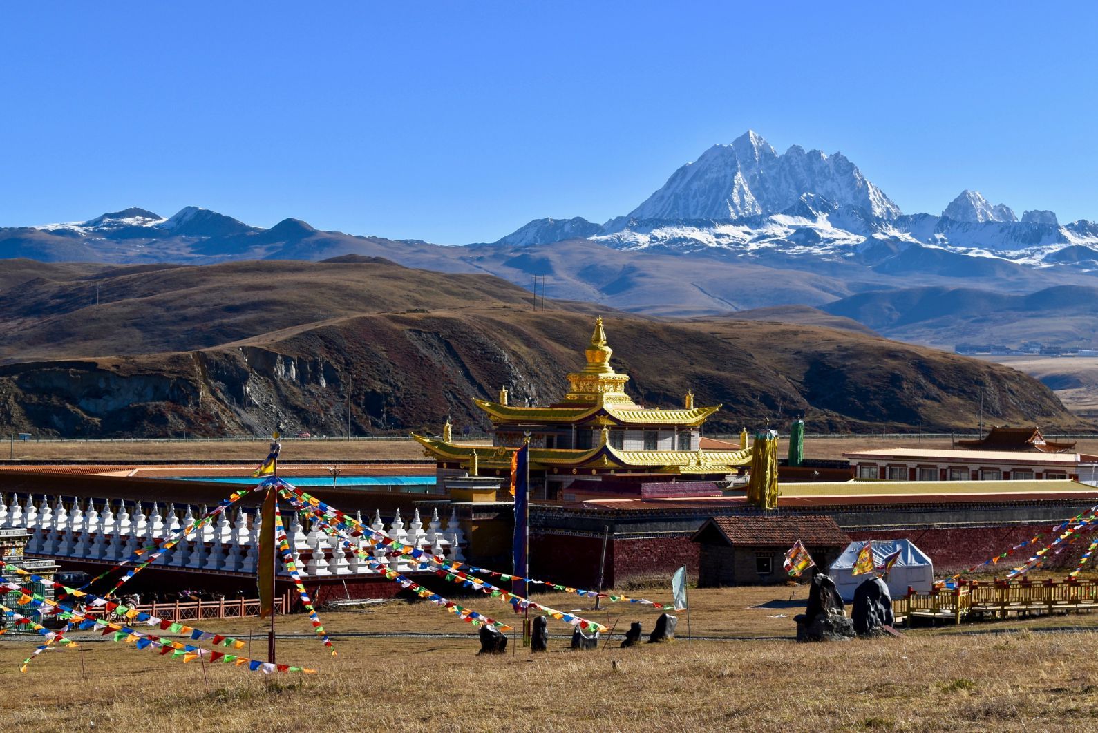 Tagong Temple, with the snowcapped summit of Mount Yala in the background.