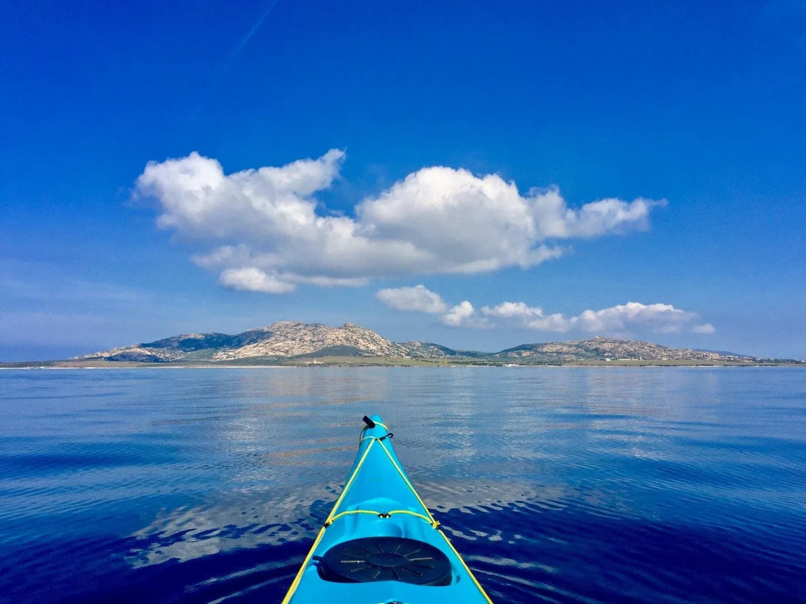 The front of a kayak in Sardinia.