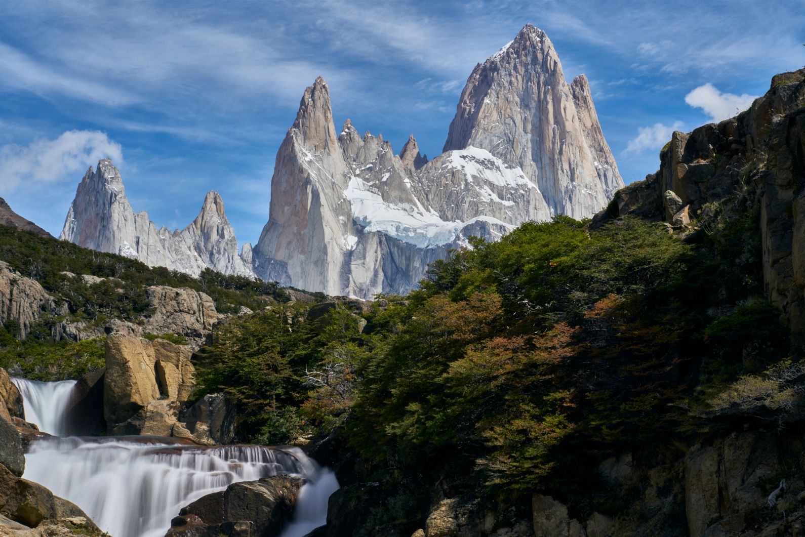 A waterfall overlooking the iconic Mount Fitz Roy peaks in El Chaltén, in the Santa Cruz Province of Argentina