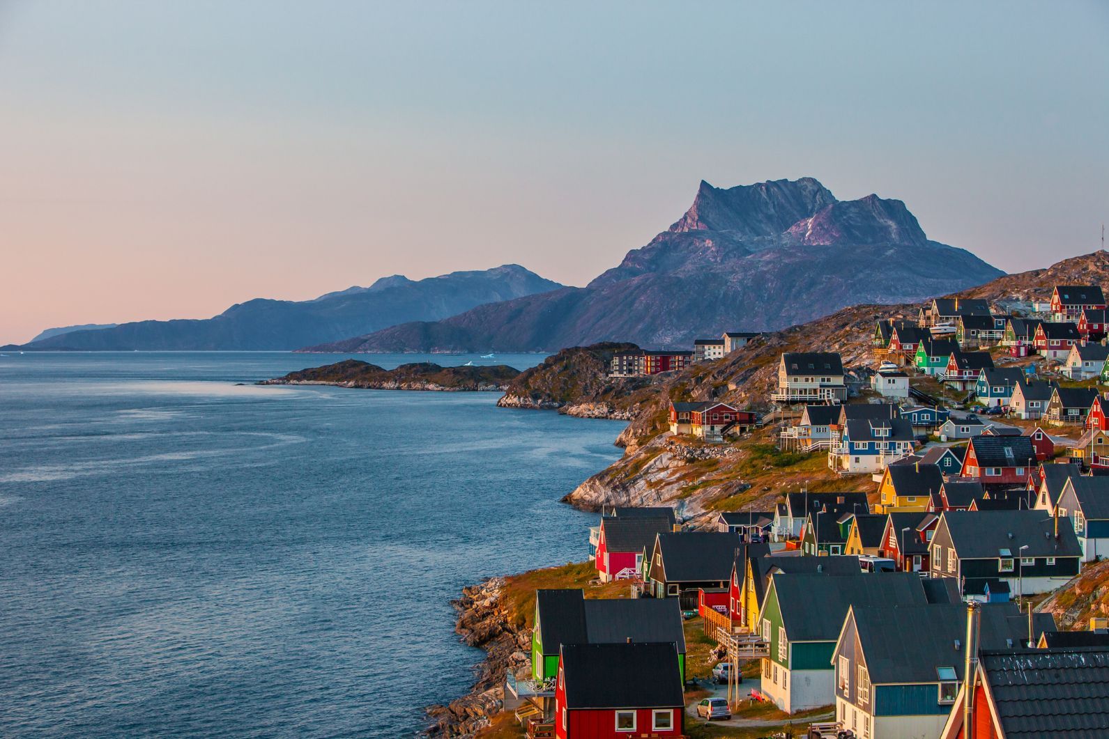 Colourful houses on the hillsides of Nuuk, the capital of Greenland, facing the ocean.