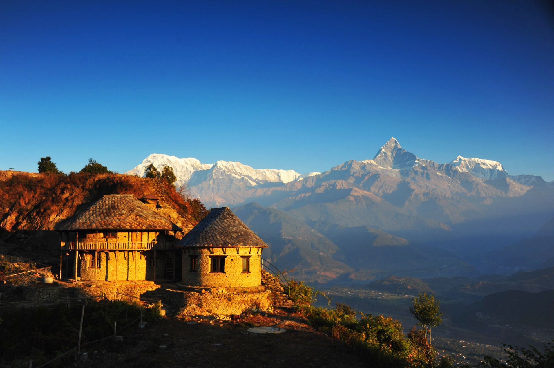 The view of a Himalayan house, near Annapurna, from the Sarangkot viewpoint. 