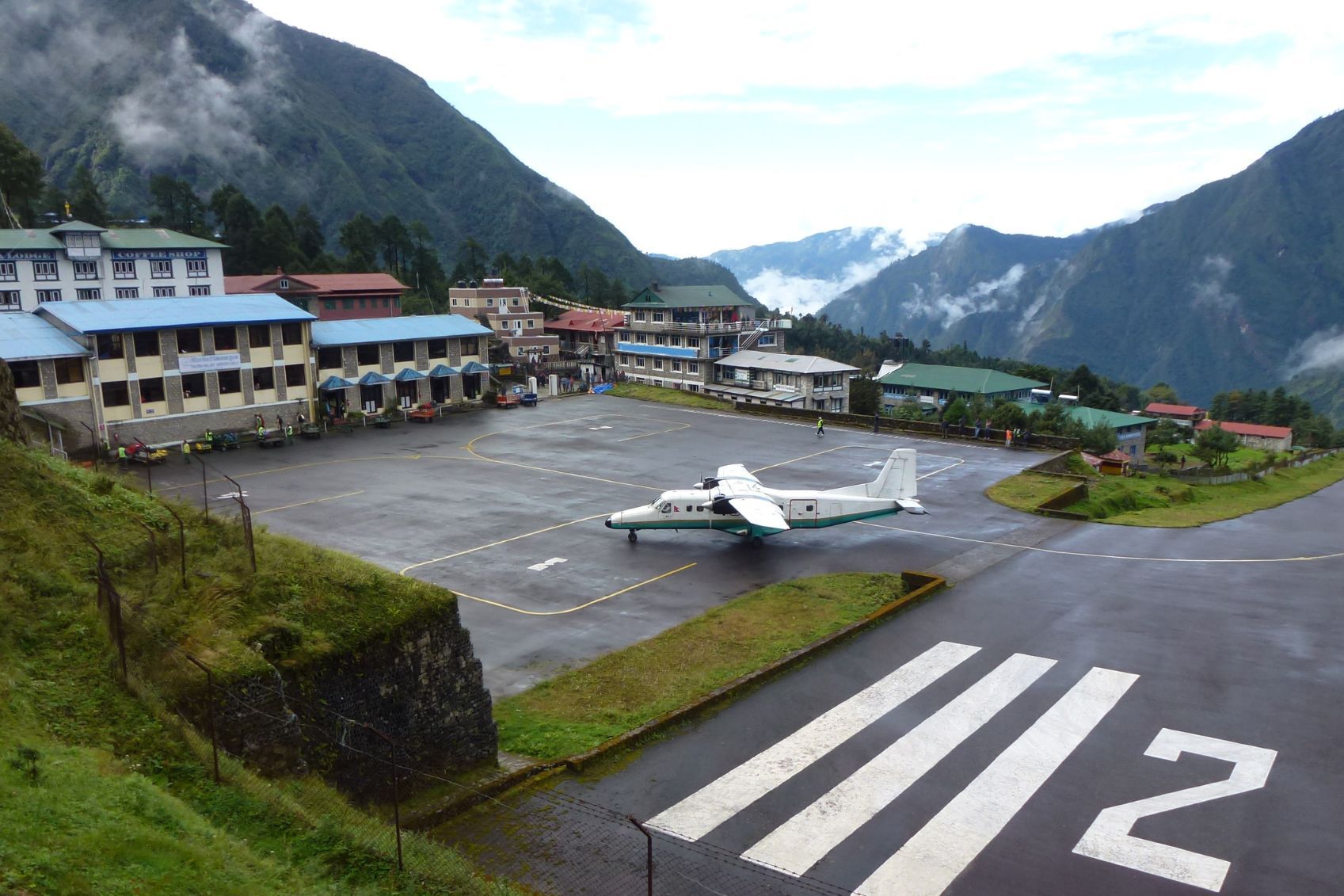 A small plane sits in the scenic Tenzing-Hillary Airport in Lukla in Nepal.