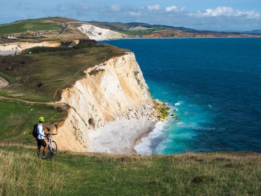 A cyclist enjoying the cliff top views from the Isle of Wight. Photo: Getty