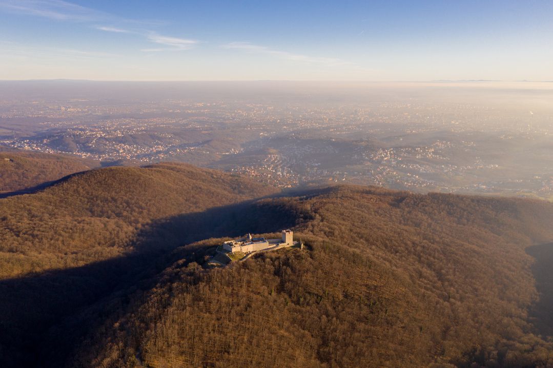 An aerial view of Medvedgrad castle with Zagreb in the distance