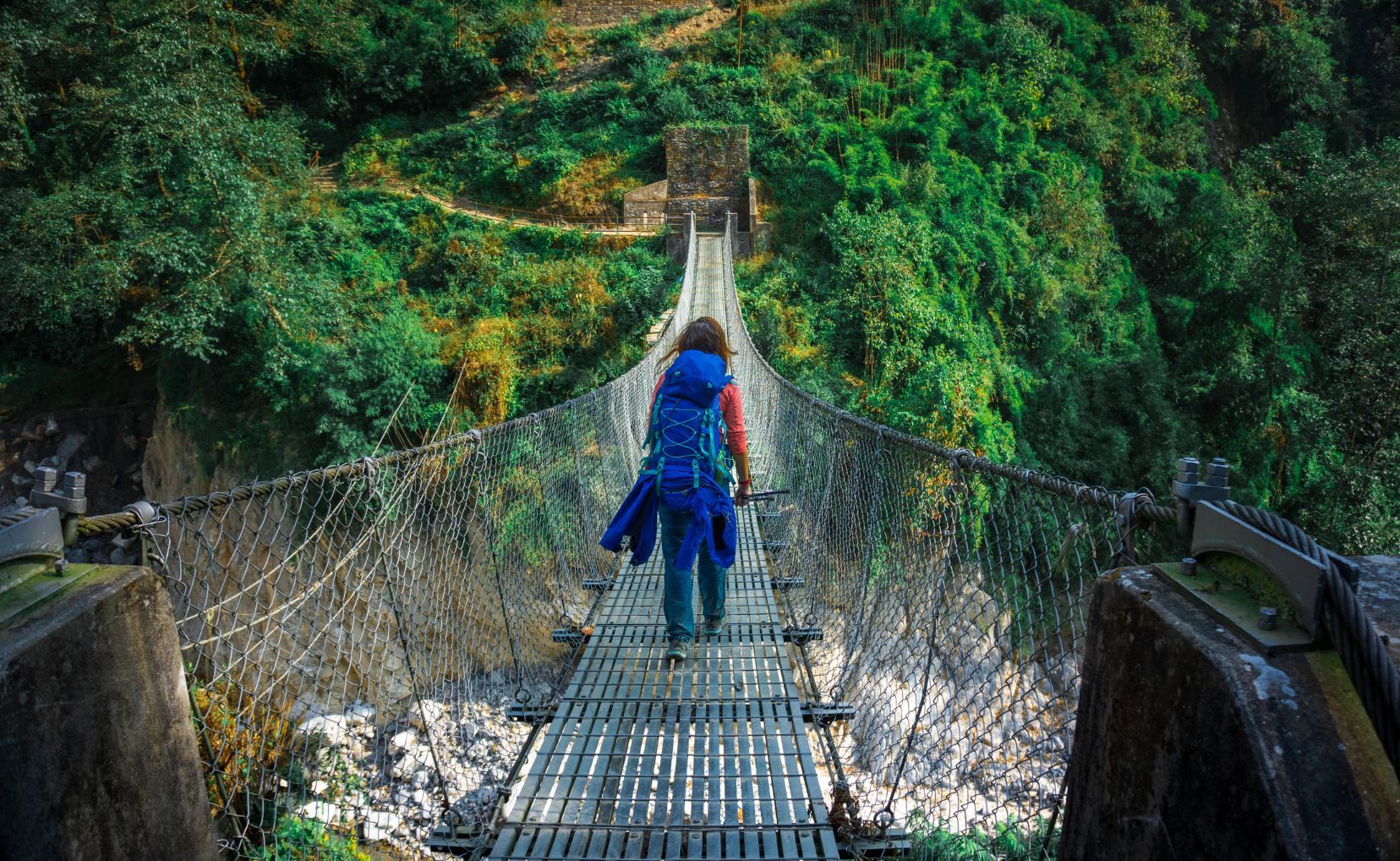 The varied terrain of the ABC trek will take you from exposed mountain trails to rivers and suspension bridges.