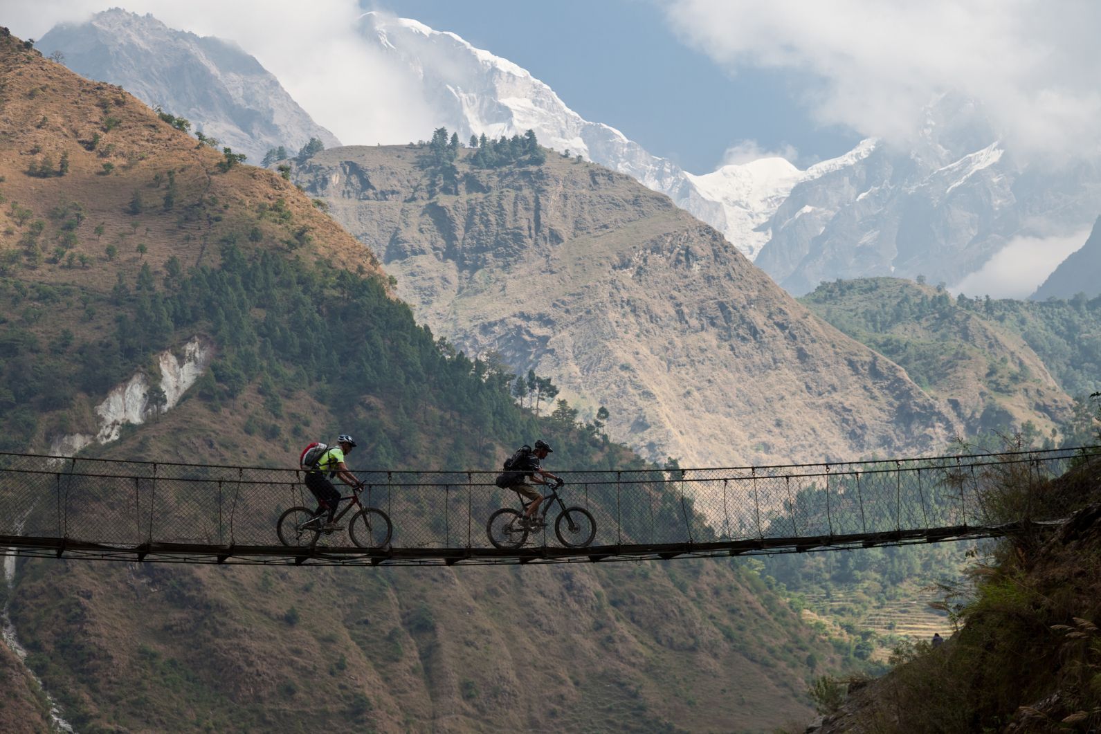 Riding over the famous Kali Gandaki suspension bridge in the Himalayas of Nepal. Photo: Getty