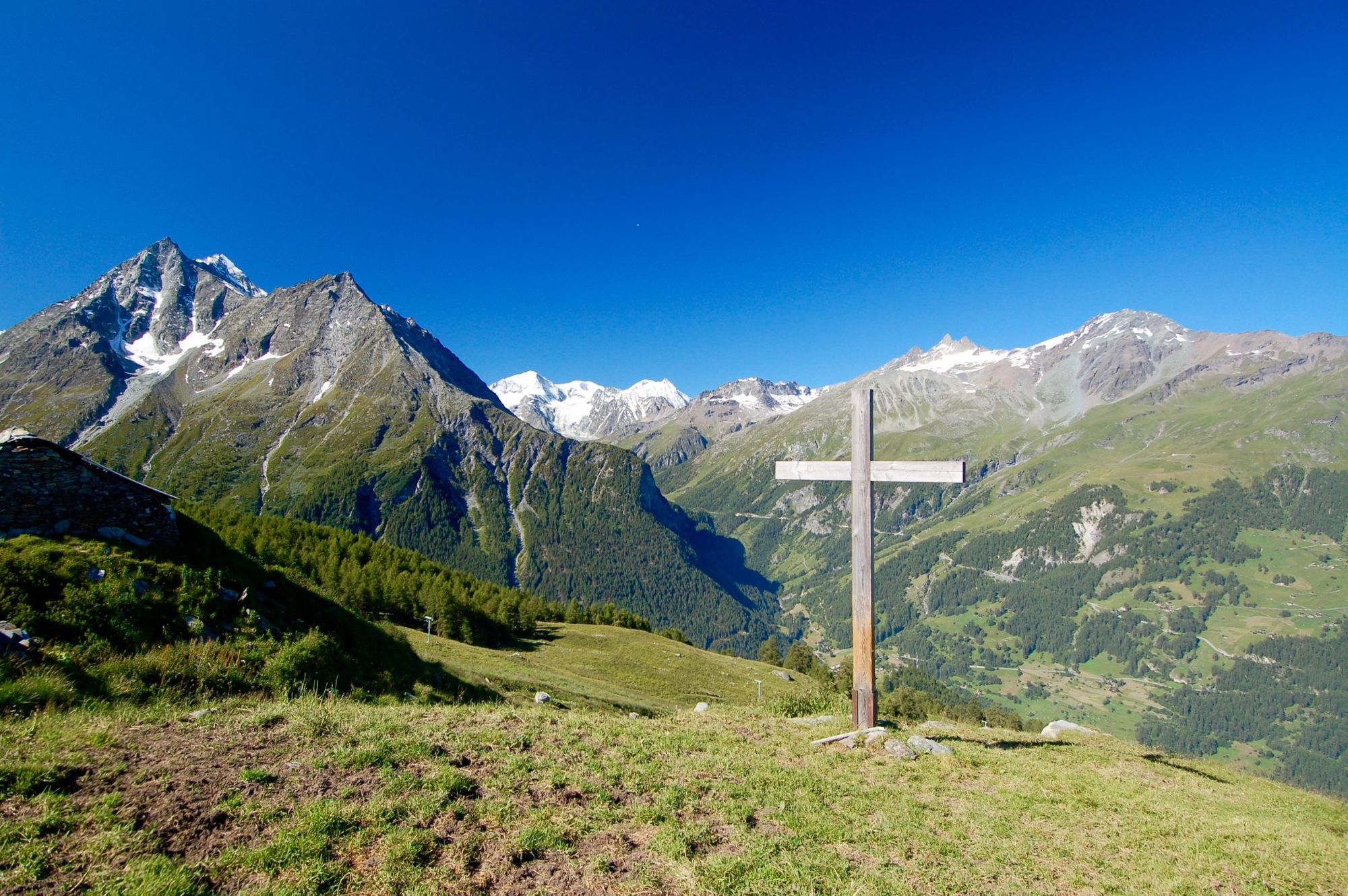 A wooden cross along The Haute Route, in the Alps