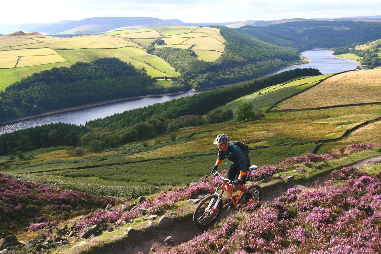 A cyclist on a trail in the Peak District.